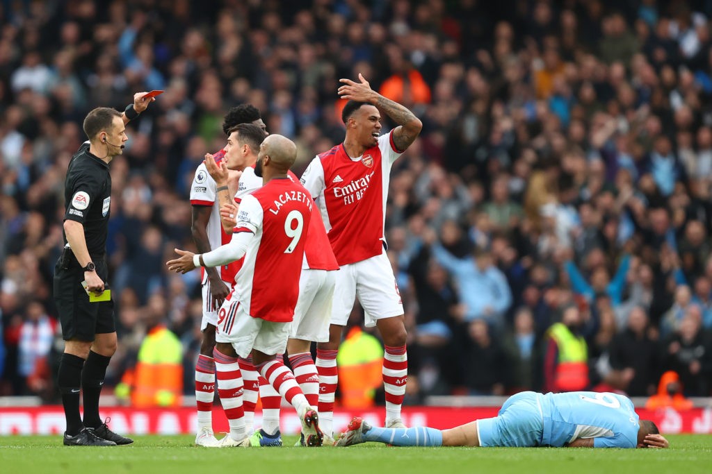 LONDON, ENGLAND: Gabriel Magalhaes of Arsenal is shown a second yellow card leading to a red card by Referee, Stuart Attwell for a foul on Gabriel Jesus of Manchester City during the Premier League match between Arsenal and Manchester City at Emirates Stadium on January 01, 2022. (Photo by Julian Finney / Getty Images)