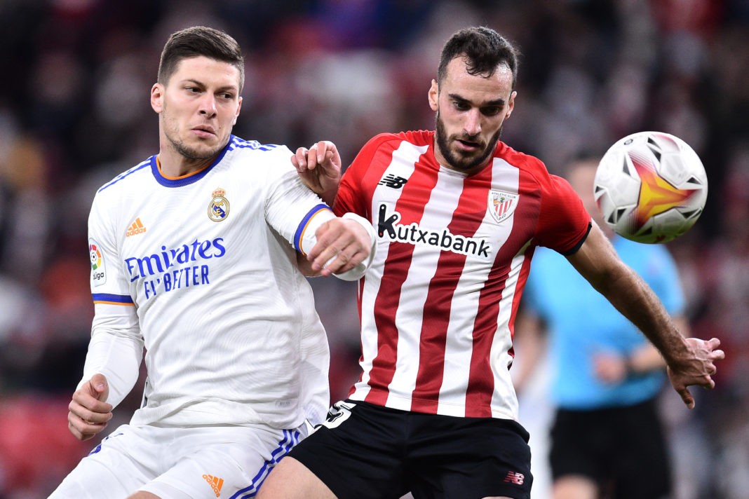 BILBAO, SPAIN - DECEMBER 22: Luka Jovic of Real Madrid battles for the ball with Inigo Lekue of Athletic Bilbao during the LaLiga Santander match between Athletic Club and Real Madrid CF at San Mames Stadium on December 22, 2021 in Bilbao, Spain. (Photo by Juan Manuel Serrano Arce/Getty Images)