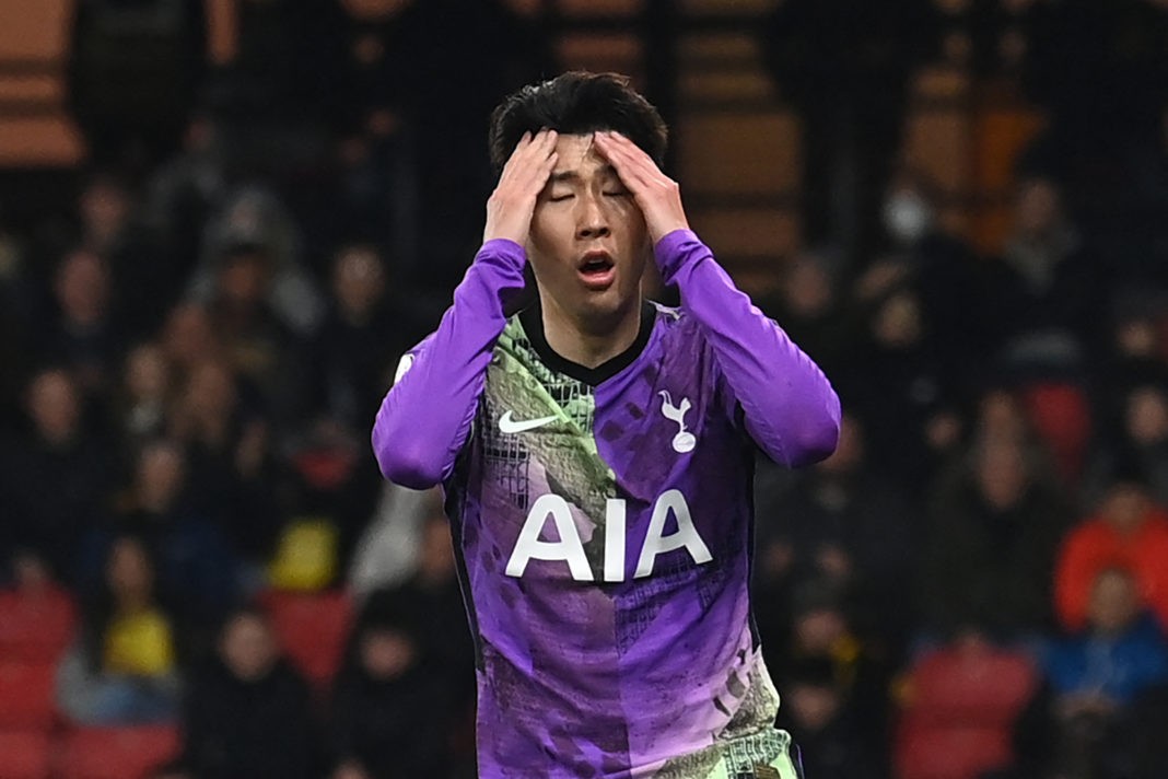 Tottenham Hotspur's South Korean striker Son Heung-Min reacts to a missed chance during the English Premier League football match between Watford and Tottenham Hotspur at Vicarage Road Stadium in Watford, southeast England, on January 1, 2022. - RESTRICTED TO EDITORIAL USE. No use with unauthorized audio, video, data, fixture lists, club/league logos or 'live' services. Online in-match use limited to 120 images. An additional 40 images may be used in extra time. No video emulation. Social media in-match use limited to 120 images. An additional 40 images may be used in extra time. No use in betting publications, games or single club/league/player publications. (Photo by Glyn KIRK / AFP) / RESTRICTED TO EDITORIAL USE. No use with unauthorized audio, video, data, fixture lists, club/league logos or 'live' services. Online in-match use limited to 120 images. An additional 40 images may be used in extra time. No video emulation. Social media in-match use limited to 120 images. An additional 40 images may be used in extra time. No use in betting publications, games or single club/league/player publications. / RESTRICTED TO EDITORIAL USE. No use with unauthorized audio, video, data, fixture lists, club/league logos or 'live' services. Online in-match use limited to 120 images. An additional 40 images may be used in extra time. No video emulation. Social media in-match use limited to 120 images. An additional 40 images may be used in extra time. No use in betting publications, games or single club/league/player publications. (Photo by GLYN KIRK/AFP via Getty Images)