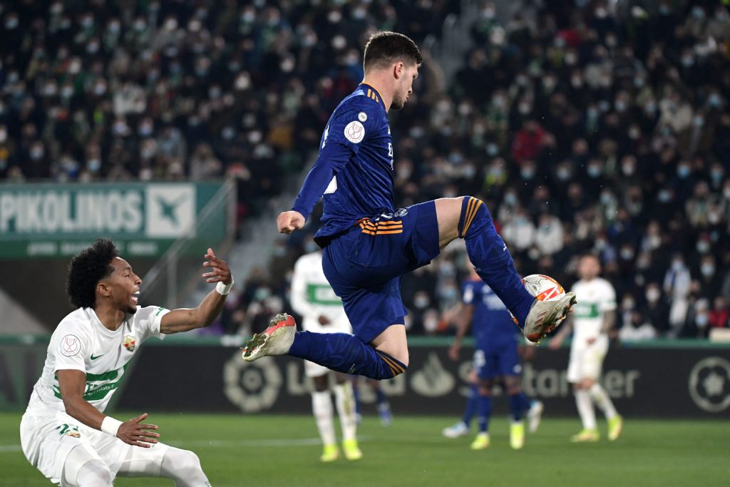 Real Madrid's Serbian forward Luka Jovic (R) controls the ball during the Copa del Rey (King's Cup) round of 16 first leg football match between Elche CF and Real Madrid CF at the Martinez Valero stadium in Elche on January 20, 2022. (Photo by JOSE JORDAN/AFP via Getty Images)