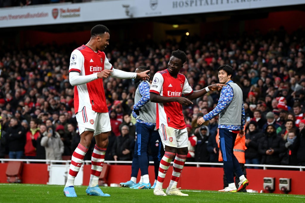 LONDON, ENGLAND - FEBRUARY 19: Bukayo Saka of Arsenal celebrates after scoring their side's second goal with Gabriel Magalhaes during the Premier League match between Arsenal and Brentford at Emirates Stadium on February 19, 2022 in London, England. (Photo by Shaun Botterill/Getty Images)