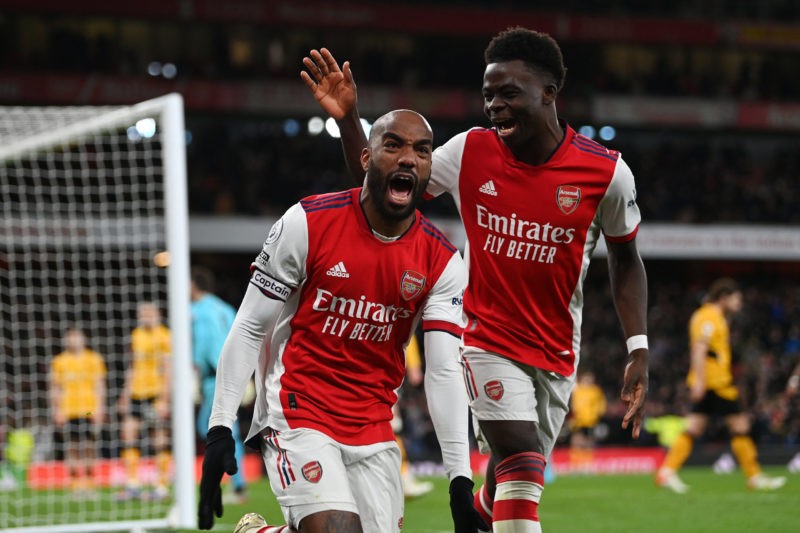 LONDON, ENGLAND - FEBRUARY 24: Alexandre Lacazette of Arsenal celebrates their sides second goal with team mate Bukayo Saka during the Premier League match between Arsenal and Wolverhampton Wanderers at Emirates Stadium on February 24, 2022 in London, England. (Photo by Shaun Botterill/Getty Images)