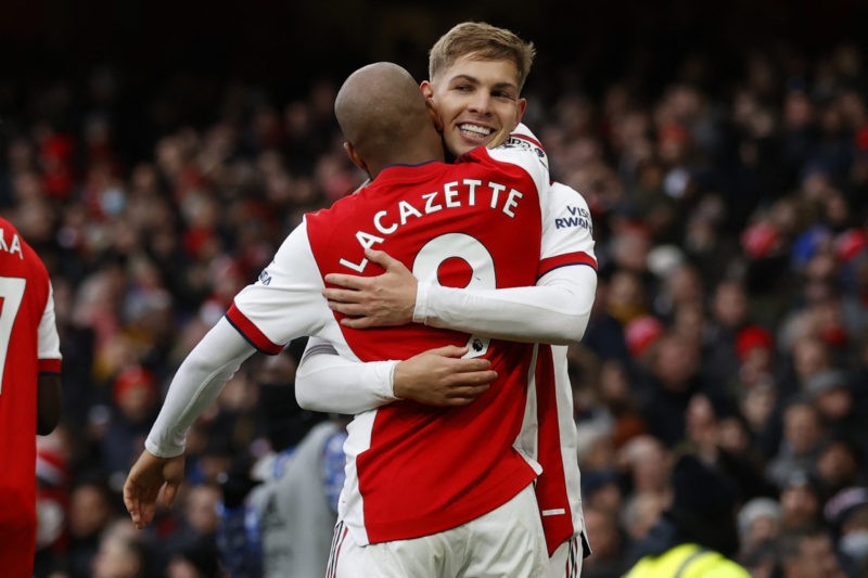 Arsenal's English midfielder Emile Smith Rowe (R) celebrates with Arsenal's French striker Alexandre Lacazette (L) after scoring the opening goal of the English Premier League football match between Arsenal and Brentford at the Emirates Stadium in London on February 19, 2022. - - (Photo by IAN KINGTON/AFP via Getty Images)