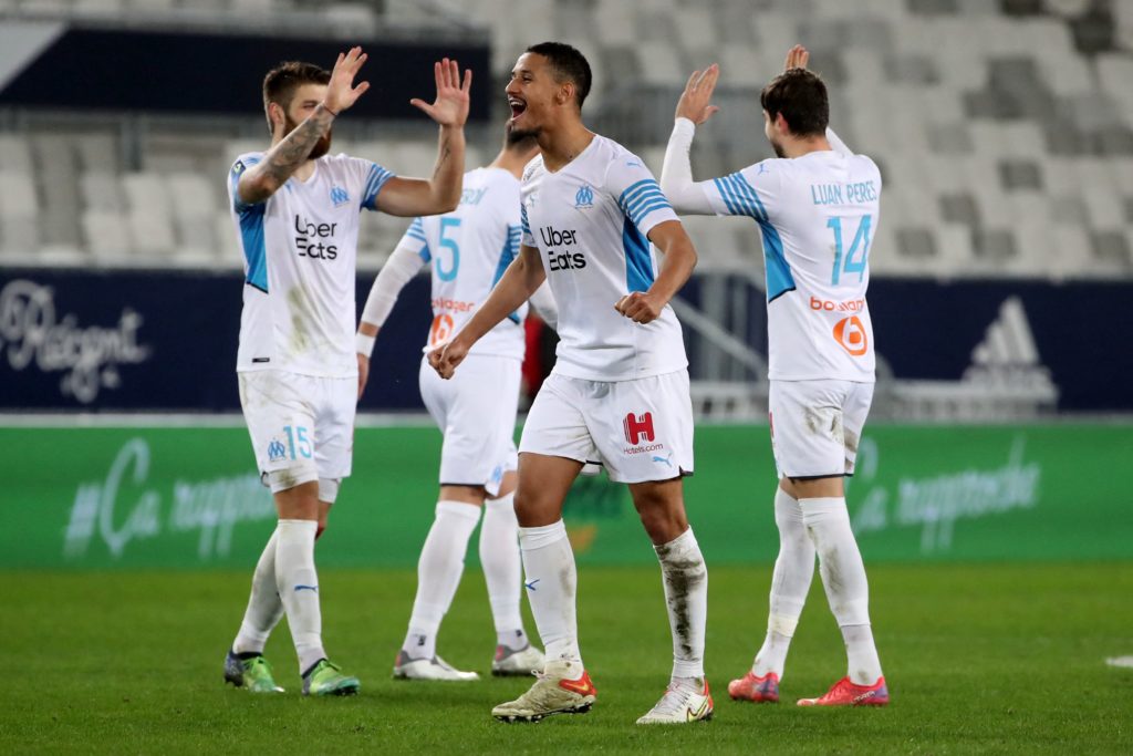 Marseille's French defender William Saliba (C) and teammates celebrate at the end of the French L1 football match between Bordeaux and Marseille on January 7, 2022. (Photo by ROMAIN PERROCHEAU/AFP via Getty Images)