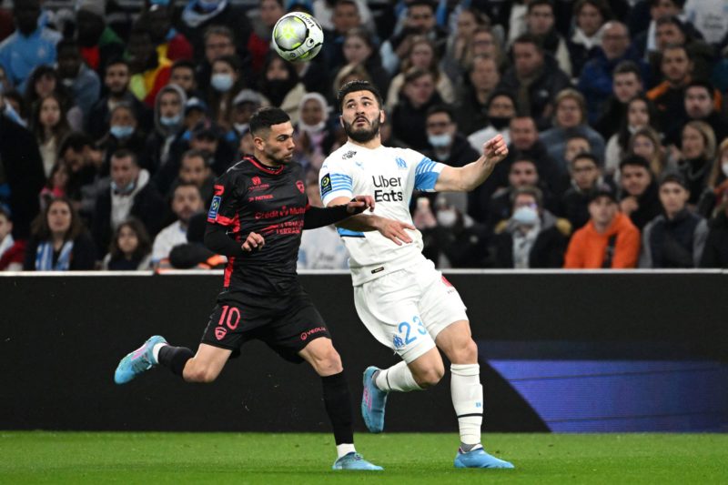 Marseille's Bosnian defender Sead Kolasinac (R) fights for the ball with Clermont's French forward Lucas Da Cunha during the French L1 football match between Olympique Marseille (OM) and Clermont Foot 63 at Stade Velodrome in Marseille, southern France on February 20, 2022. (Photo by Christophe SIMON / AFP) 