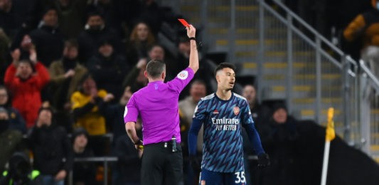 WOLVERHAMPTON, ENGLAND - FEBRUARY 10: Gabriel Martinelli of Arsenal is shown a red card by referee Michael Oliver during the Premier League match between Wolverhampton Wanderers and Arsenal at Molineux on February 10, 2022 in Wolverhampton, England. (Photo by Shaun Botterill/Getty Images)