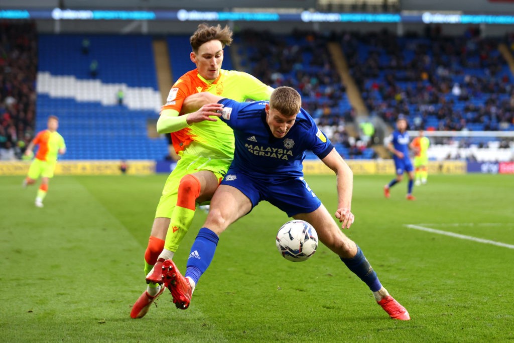 CARDIFF, WALES: Mark McGuinness of Cardiff City battles for possession with James Garner of Nottingham Forest during the Sky Bet Championship match between Cardiff City and Nottingham Forest at Cardiff City Stadium on January 30, 2022. (Photo by Dan Istitene/ Getty Images)