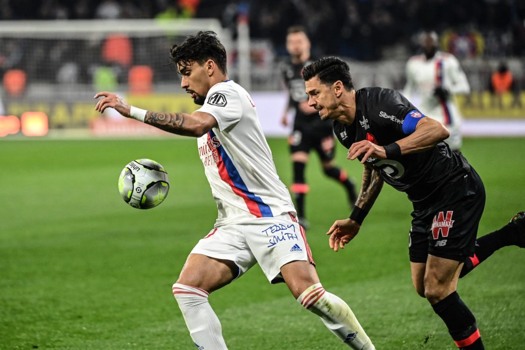 Lyons Brazilian midfielder Lucas Paqueta (L) fights for the ball with Lille's Portuguese defender Jose Fonte (R) during the French L1 football match between Olympique Lyonnais (OL) and Lille (Losc) at The Groupama Stadium in Decines-Charpieu, central-eastern France on February 27, 2022. (Photo by OLIVIER CHASSIGNOLE / AFP via Getty Images)