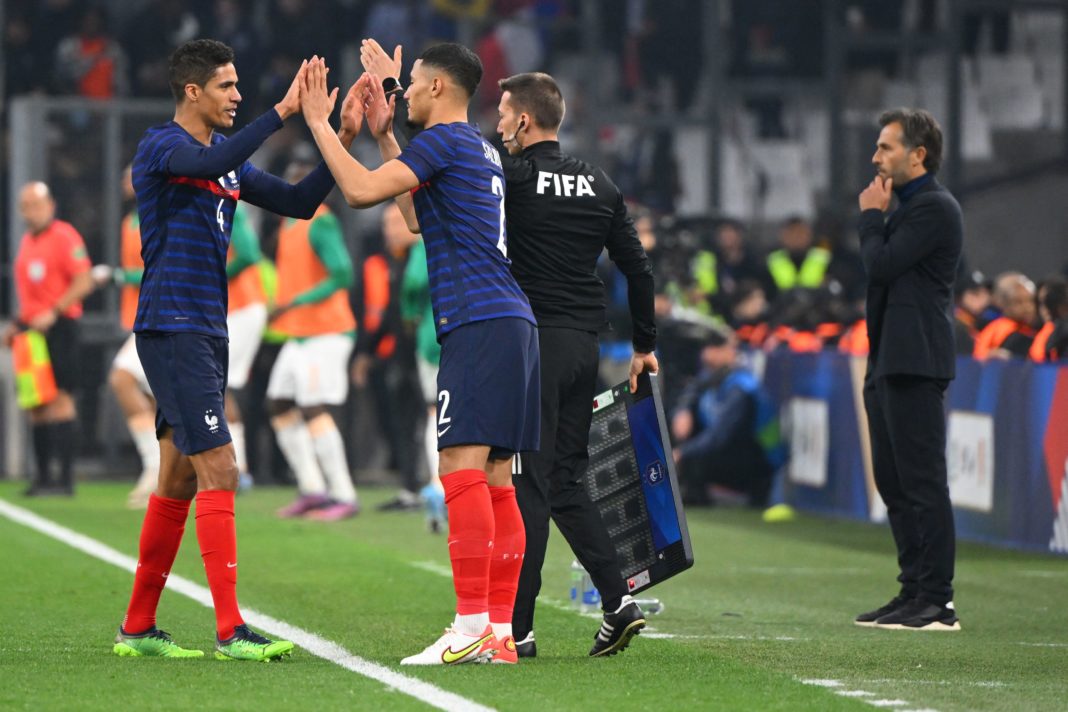 France's defender Raphael Varane (L) leaves the field to be replaced by France's defender William Saliba (C) during the friendly football match between France and Ivory Coast at the Velodrome Stadium in Marseille, southern France, on March 25, 2022. (Photo by NICOLAS TUCAT/AFP via Getty Images)