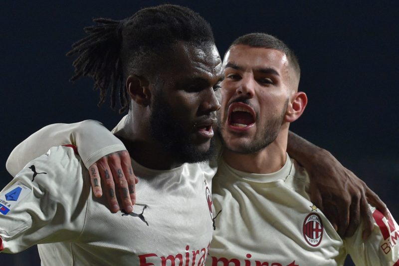 AC Milan's Ivorian midfielder Franck Kessie (L) celebrates with AC Milan's French defender Theo Hernandez after opening the scoring during the Italian Serie A football match between Empoli and AC Milan on December 22, 2021 at the Carlo-Castellani stadium in Empoli. (Photo by Andreas SOLARO / AFP) (Photo by ANDREAS SOLARO/AFP via Getty Images)