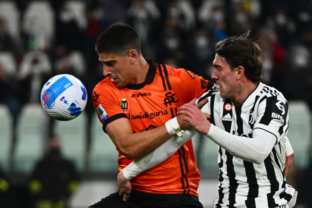 Juventus forward Dusan Vlahovic fights for the ball with Spezia midfielder Dimitris Nikolaou during the Italian Serie A football match between Juventus and Spezia at the Juventus stadium in Turin on March 6, 2022. (Photo by MIGUEL MEDINA/AFP via Getty Images)
