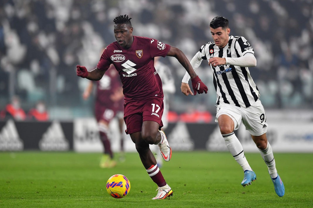 TURIN, ITALY: Wilfried Singo of Torino FC in action against Alvaro Morata of Juventus during the Serie A match between Juventus and Torino FC at Allianz Stadium on February 18, 2022. (Photo by Valerio Pennicino/Getty Images)