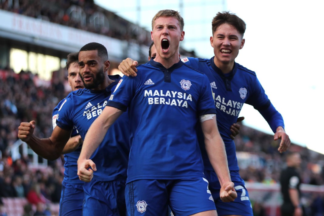 STOKE ON TRENT, ENGLAND: Cardiff City's Mark McGuinness, Rubin Colwill and Curtis Nelson celebrate after teammate Kieffer Moore scores his sides third goal to make the score 3-3 during the Sky Bet Championship match between Stoke City and Cardiff City at Bet365 Stadium on October 30, 2021. (Photo by Ashley Allen/Getty Images)