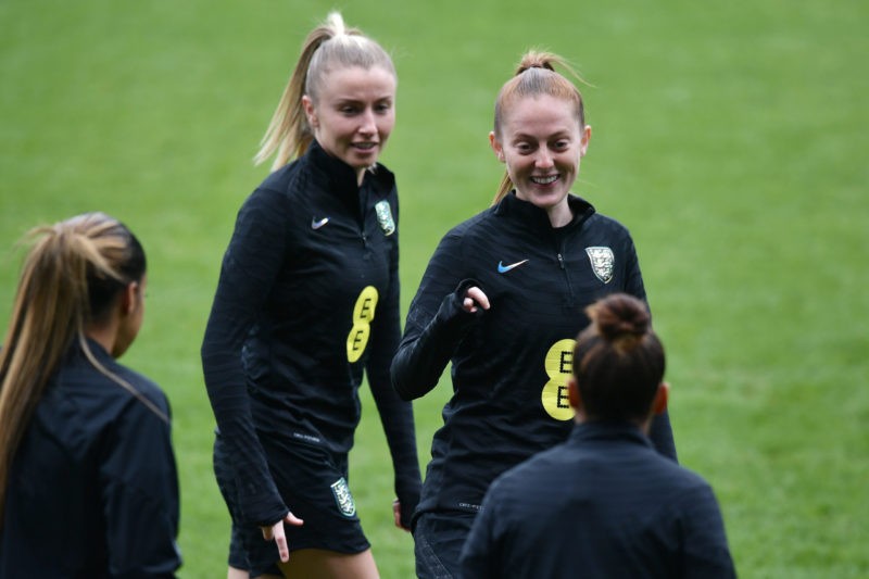 BELFAST, NORTHERN IRELAND - APRIL 11: Leah Williamson of England (L) and Keira Walsh of England react during a training session ahead of their 2023 FIFA Women's World Cup qualifier match against Northern Ireland at Windsor Park on April 11, 2022 in Belfast, Northern Ireland. (Photo by Charles McQuillan/Getty Images)