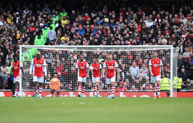 Arsenal players react after conceding a second goal during the English Premier League football match between Arsenal and Brighton and Hove Albion at the Emirates Stadium in London on April 9, 2022. (Photo by JUSTIN TALLIS/AFP via Getty Images)