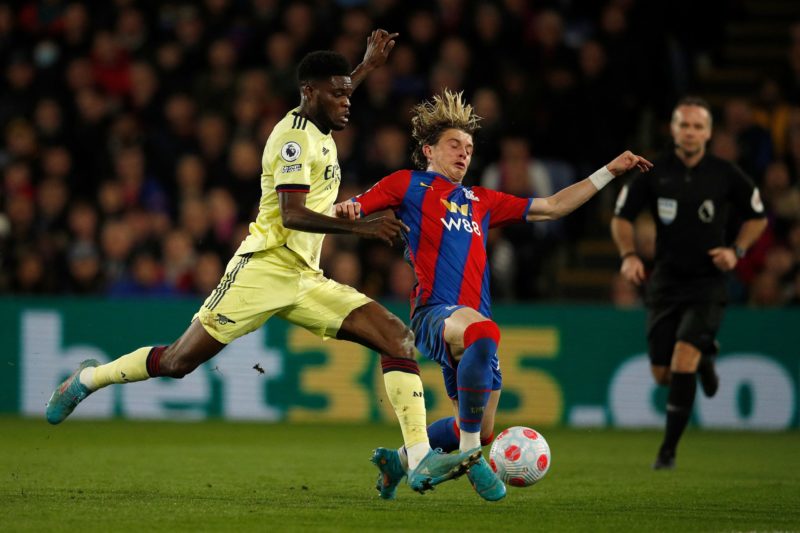 Crystal Palace's English midfielder Conor Gallagher (R) tackles Arsenal's Ghanaian midfielder Thomas Partey during the English Premier League football match between Crystal Palace and Arsenal at Selhurst Park in south London on April 4, 2022. (Photo by ADRIAN DENNIS/AFP via Getty Images)