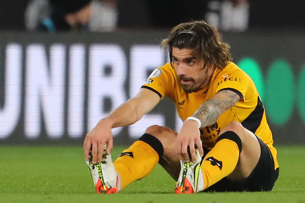 Wolverhampton Wanderers' Portuguese midfielder Ruben Neves reacts after suffering an injury during the English Premier League football match between Wolverhampton Wanderers and Leeds United at the Molineux stadium in Wolverhampton, central England on March 18, 2022.(Photo by GEOFF CADDICK/AFP via Getty Images)