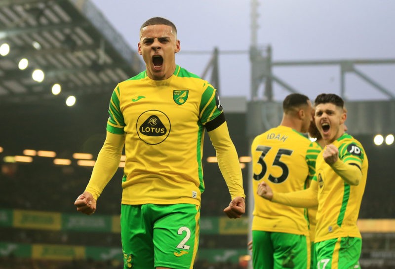 NORWICH, ENGLAND - JANUARY 15: Max Aarons of Norwich City celebrates after their side's first goal, an own goal scored by Michael Keane of Everton during the Premier League match between Norwich City and Everton at Carrow Road on January 15, 2022 in Norwich, England. (Photo by Stephen Pond/Getty Images)