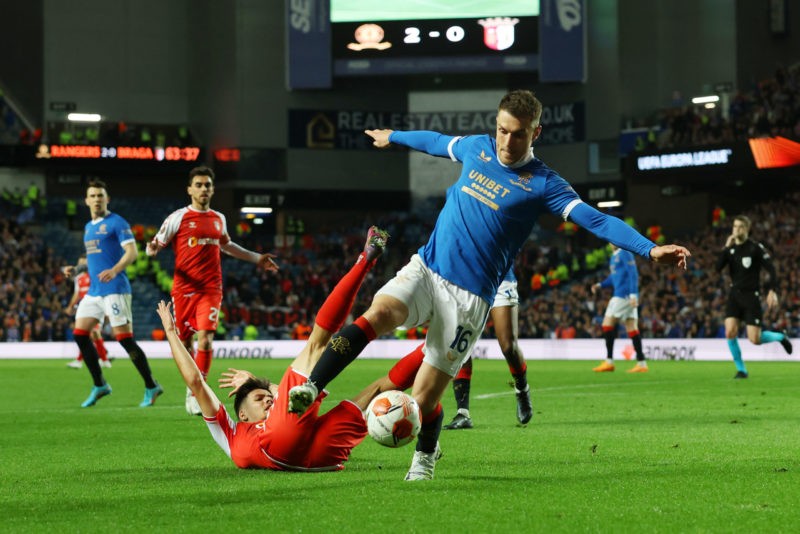 GLASGOW, SCOTLAND - APRIL 14: Aaron Ramsey of Rangers runs past Francisco Moura of Sporting Braga during the UEFA Europa League Quarter Final Leg Two match between Rangers FC and Sporting Braga at Ibrox Stadium on April 14, 2022 in Glasgow, Scotland. (Photo by Ian MacNicol/Getty Images)