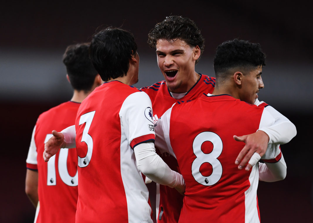 LONDON, ENGLAND: Salah Oulad M'Hand of Arsenal (R) is congratulated by teammates Joel Lopez (L) and Omar Rekik (C) after scoring their team's second goal during the Premier League 2 match between Arsenal U23 and Brighton & Hove Albion U23 at Emirates Stadium on October 01, 2021. (Photo by Alex Burstow/Getty Images)