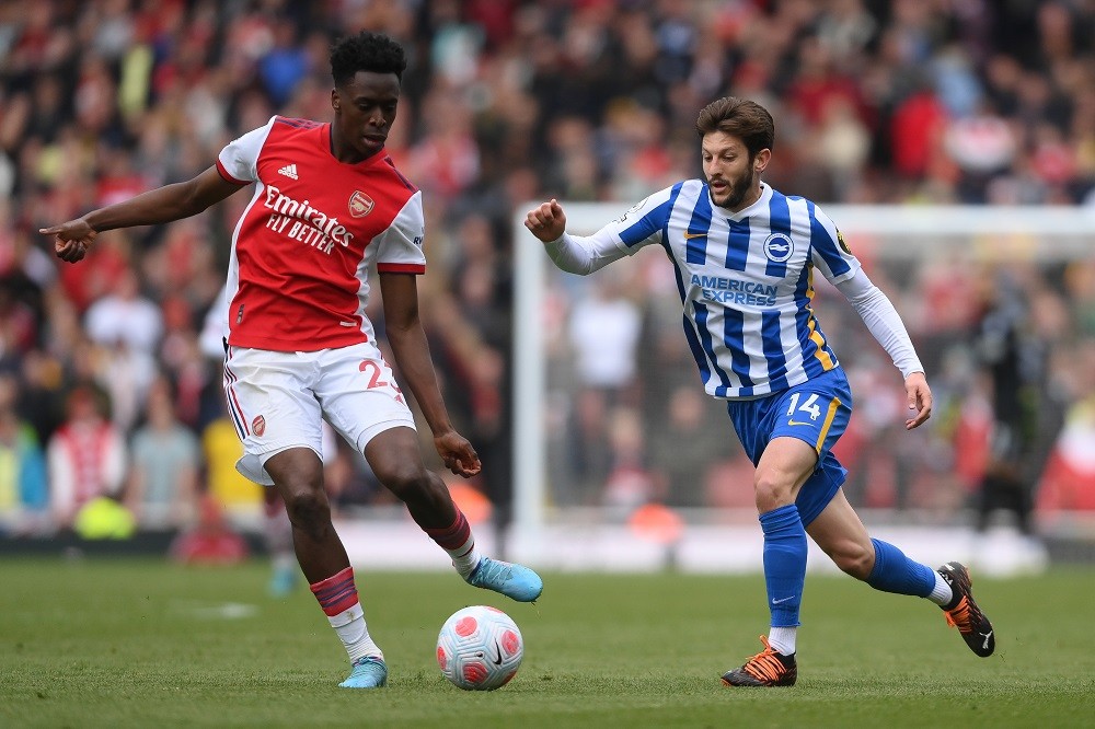 LONDON, ENGLAND: Albert Sambi Lokonga of Arsenal is challenged by Adam Lallana of Brighton & Hove Albion during the Premier League match between Arsenal and Brighton & Hove Albion at Emirates Stadium on April 09, 2022. (Photo by Mike Hewitt/Getty Images)