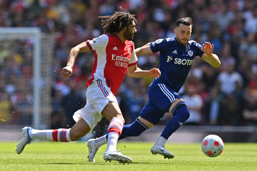 Arsenal's Egyptian midfielder Mohamed Elneny (L) vies with Leeds United's English midfielder Jack Harrison (R) during the English Premier League football match between Arsenal and Leeds United at the Emirates Stadium in London on May 8, 2022. (Photo by GLYN KIRK/AFP via Getty Images)