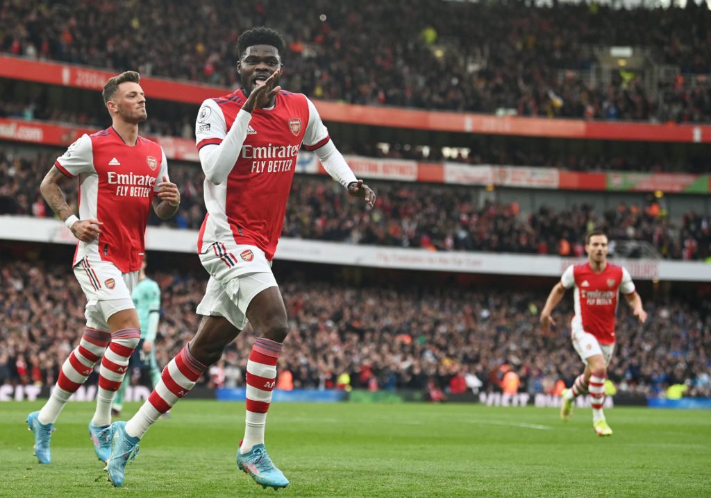 Arsenal's Ghanaian midfielder Thomas Partey celebrates scoring his team's first goal during the English Premier League soccer match between Arsenal and Leicester City at the Emirates Stadium in London on March 13, 2022. (Photo by GLYN KIRK/AFP via Getty Images)