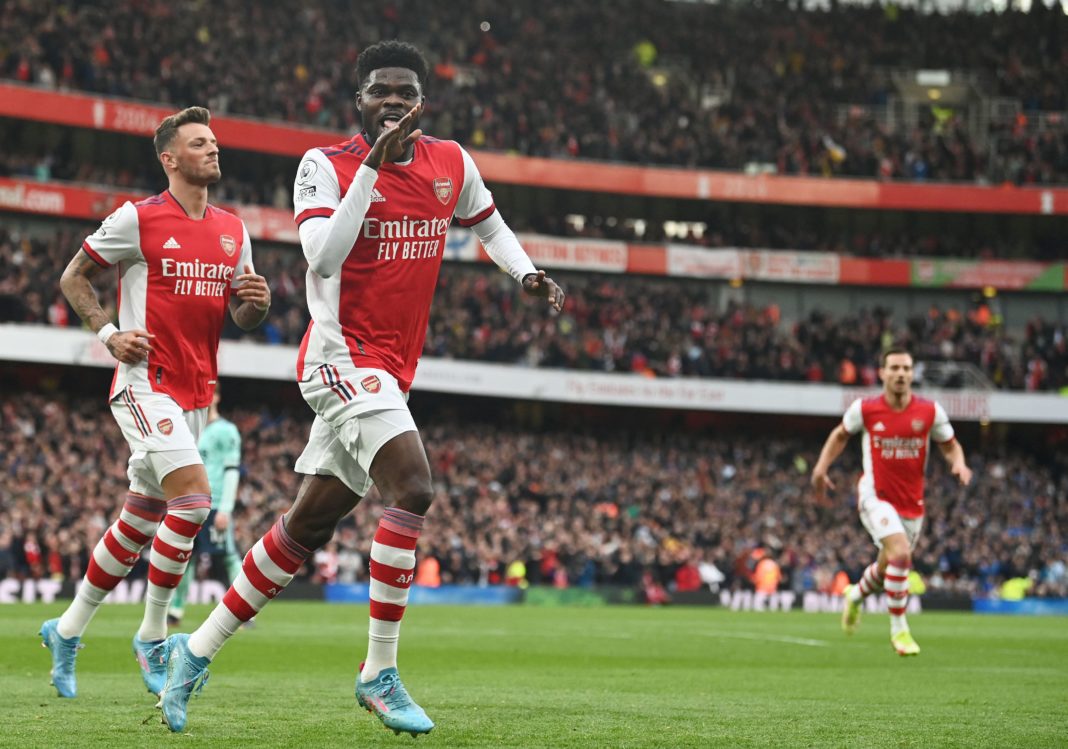 Arsenal's Ghanaian midfielder Thomas Partey celebrates scoring his team's first goal during the English Premier League football match between Arsenal and Leicester City at The Emirates Stadium in London on March 13, 2022. (Photo by GLYN KIRK/AFP via Getty Images)