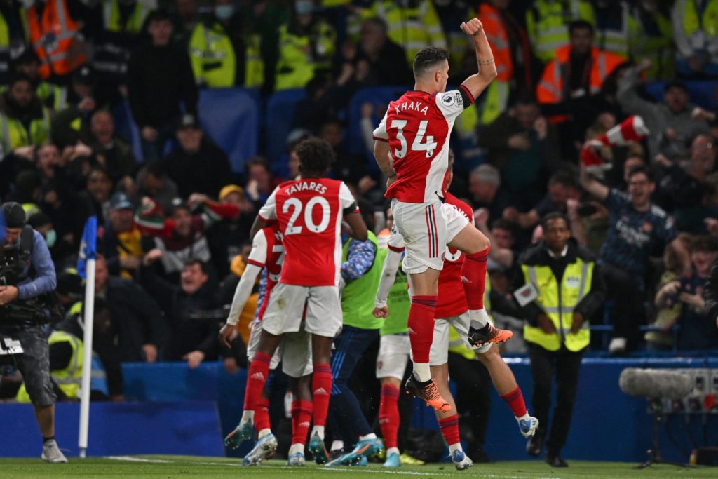 Arsenal's English striker Eddie Nketiah celebrates with teammates after scoring their third goal during the English Premier League football match between Chelsea and Arsenal at Stamford Bridge in London on April 20, 2022. (Photo by GLYN KIRK/AFP via Getty Images)