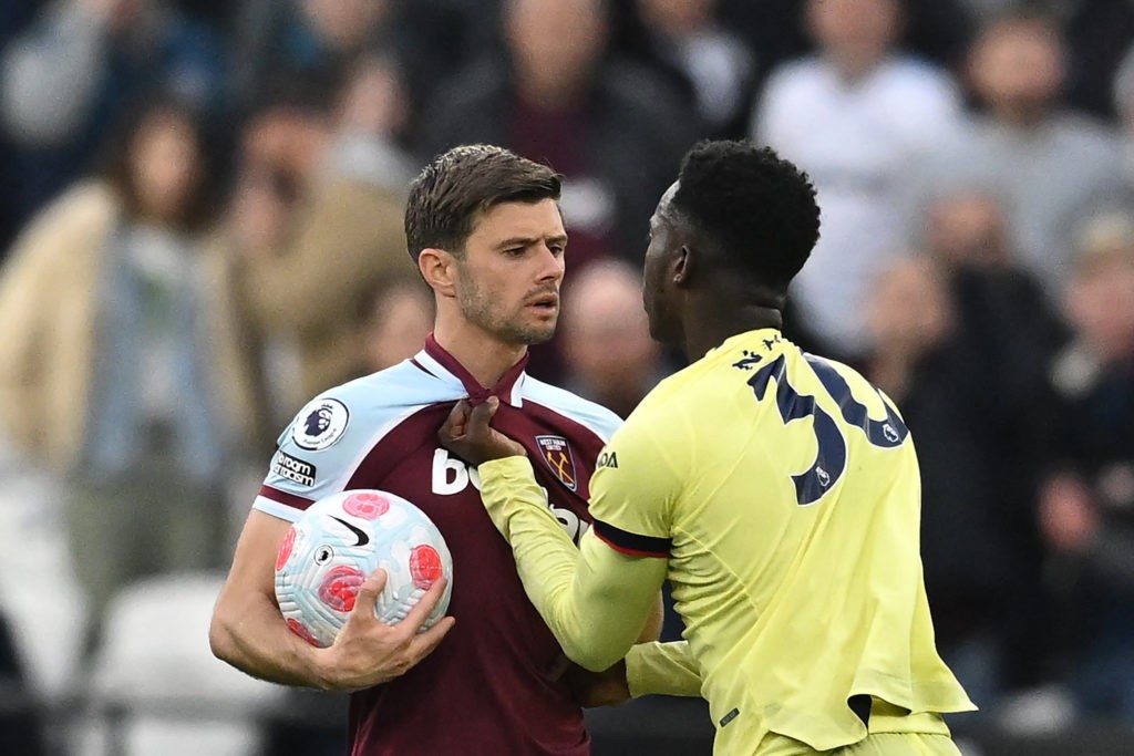 Arsenal's English striker Eddie Nketiah (R) argues with West Ham United's English defender Aaron Cresswell during the English Premier League football match between West Ham United and Arsenal at the London Stadium, in London on May 1, 2022. (Photo by BEN STANSALL/AFP via Getty Images)