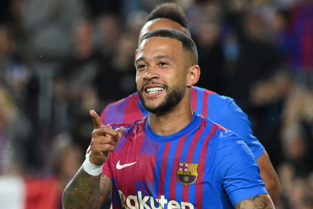 Barcelona's Dutch forward Memphis Depay celebrates after scoring a goal during the Spanish league football match between FC Barcelona and RC Celta de Vigo at the Camp Nou stadium in Barcelona on May 10, 2022. (Photo by LLUIS GENE/AFP via Getty Images)
