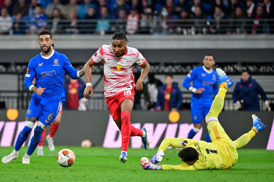 Leipzig's French midfielder Christopher Nkunku (C) gets through on Rangers' Scottish goalkeeper Allan McGregor's (R) goal but fails to score during the UEFA Europa League semi-final, first leg football match RB Leipzig v Rangers in Leipzig on April 28, 2022. (Photo by JOHN MACDOUGALL/AFP via Getty Images)
