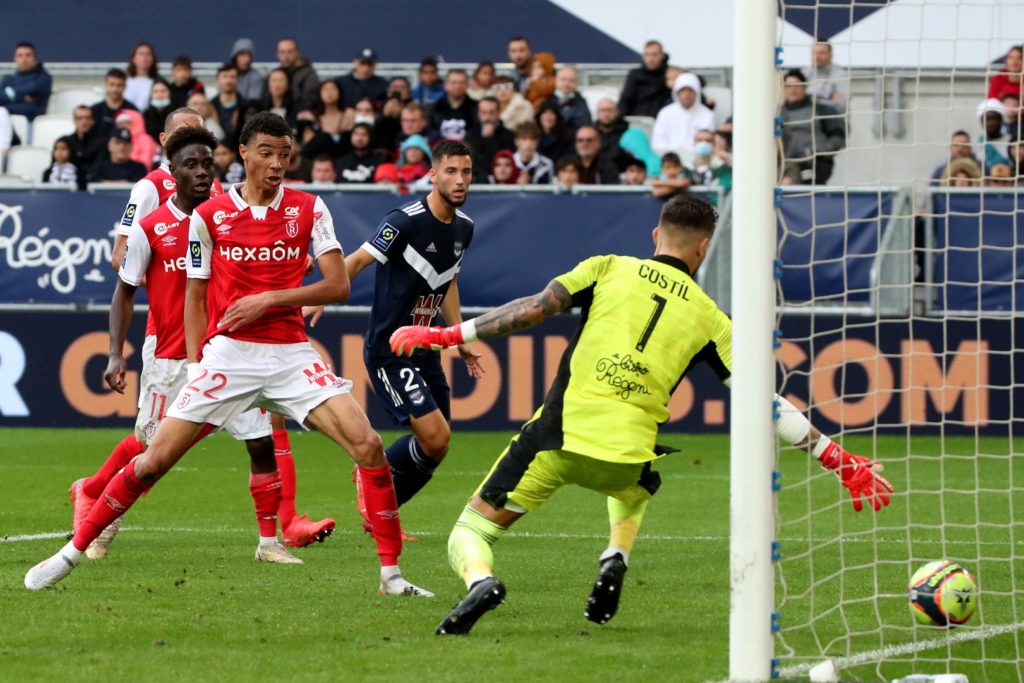 Reims' French forward Hugo Ekitike (C) scores during the French L1 football match between FC Girondins de Bordeaux and Stade de Reims at The Matmut Atlantique Stadium in Bordeaux, south-western France on October 31, 2021. (Photo by ROMAIN PERROCHEAU/AFP via Getty Images)