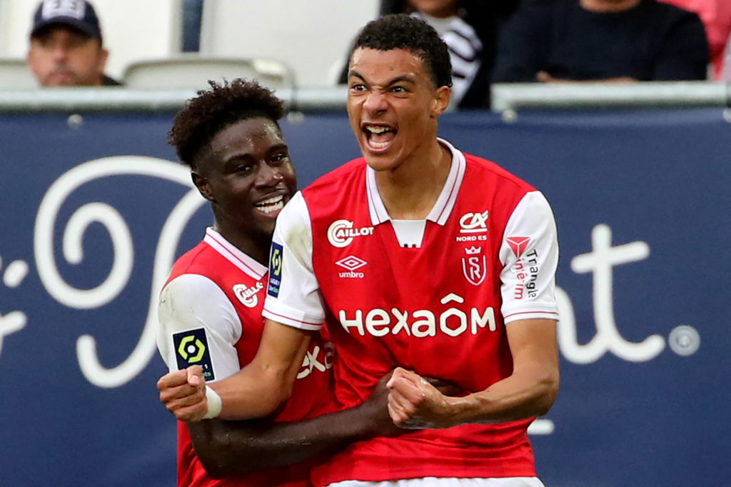 Reims' French forward Hugo Ekitike (R) celebrates after scoring during the French L1 football match between FC Girondins de Bordeaux and Stade de Reims at The Matmut Atlantique Stadium in Bordeaux, south-western France on October 31, 2021. (Photo by ROMAIN PERROCHEAU/AFP via Getty Images)