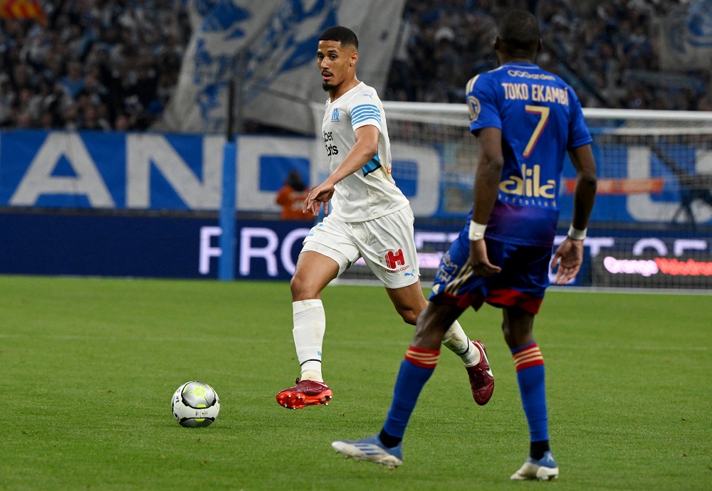 Marseille's French defender William Saliba (C) runs with the ball during the French L1 football match between Olympique Marseille (OM) and Lyon (OL) at the Stade Velodrome in Marseille, southern France, on May 1, 2022. (Photo by NICOLAS TUCAT/AFP via Getty Images)
