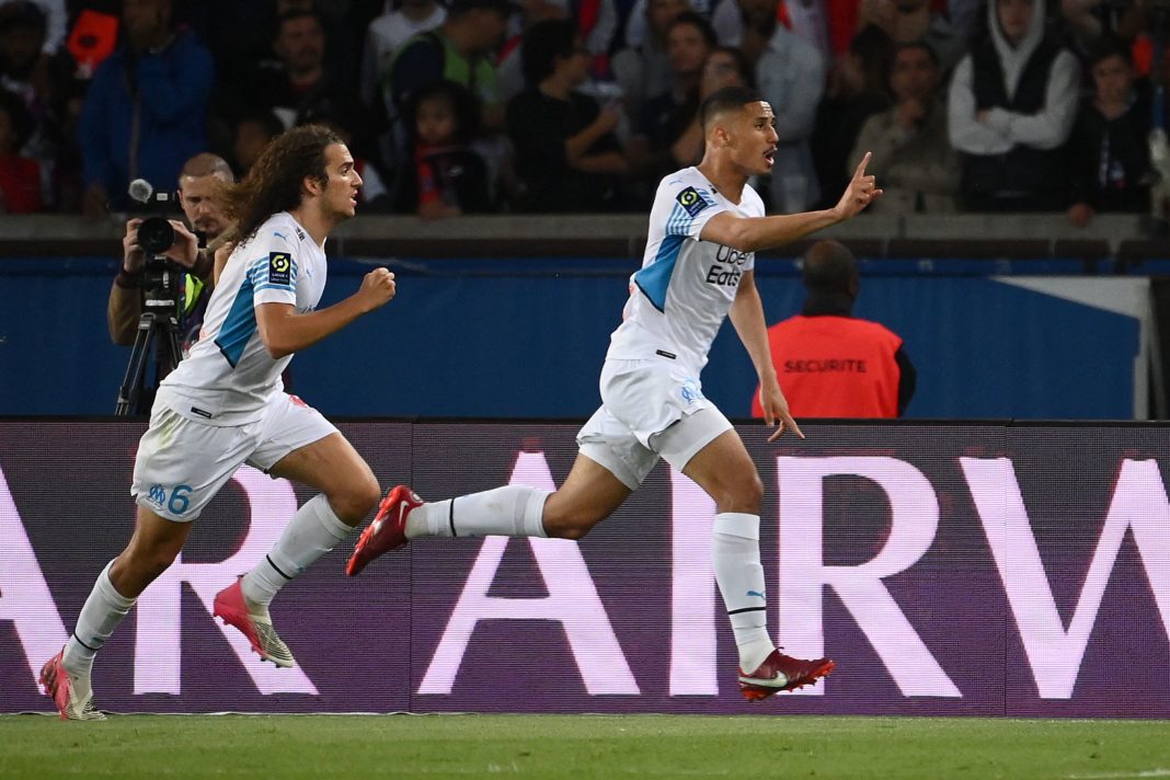 Marseille's French defender William Saliba (R) celebrates scoring his team's second goal - disallowed by the VAR - during the French L1 football match between Paris Saint-Germain (PSG) and Olympique de Marseille (OM) at the Parc des Princes stadium in Paris on April 17, 2022. (Photo by FRANCK FIFE/AFP via Getty Images)