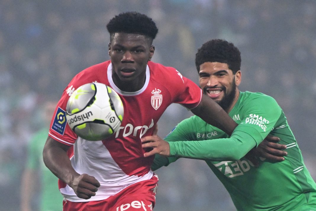 Monaco's French midfielder Aurelien Tchouameni (L) fights for the ball with Saint-Etienne's French midfielder Mahdi Camara during the French L1 football match between Saint-Etienne (ASSE) and AS Monaco at The Geoffroy Guichard Stadium in Saint-Etienne, south-eastern France on April 23, 2022. (Photo by JEAN-PHILIPPE KSIAZEK/AFP via Getty Images)