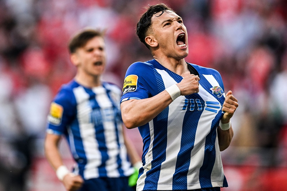 Porto's Brazilian forward Pepe Cossa celebrates after Porto's Nigerian defender Zaidu Sanusi scored a goal during the Portuguese League football between SL Benfica and FC Porto at the Luz stadium in Lisbon on May 7, 2022. (Photo by PATRICIA DE MELO MOREIRA/AFP via Getty Images)