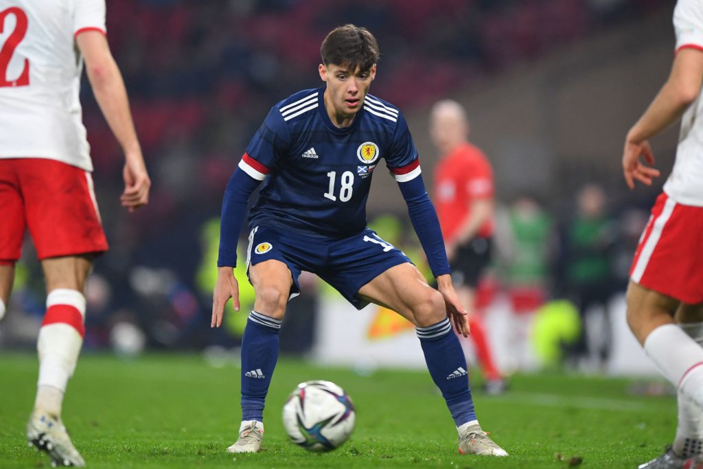 Scotland's defender Aaron Hickey keeps his eyes on the ball during the friendly football match between Scotland and Poland at Hampden Park in Glasgow on March 24, 2022. (Photo by ANDY BUCHANAN/AFP via Getty Images)