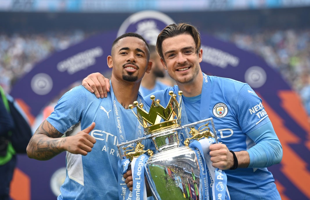 MANCHESTER, ENGLAND: Gabriel Jesus and Jack Grealish of Manchester City celebrate with the Premier League trophy after their side finished the season as Premier League champions during the Premier League match between Manchester City and Aston Villa at Etihad Stadium on May 22, 2022. (Photo by Shaun Botterill/Getty Images)