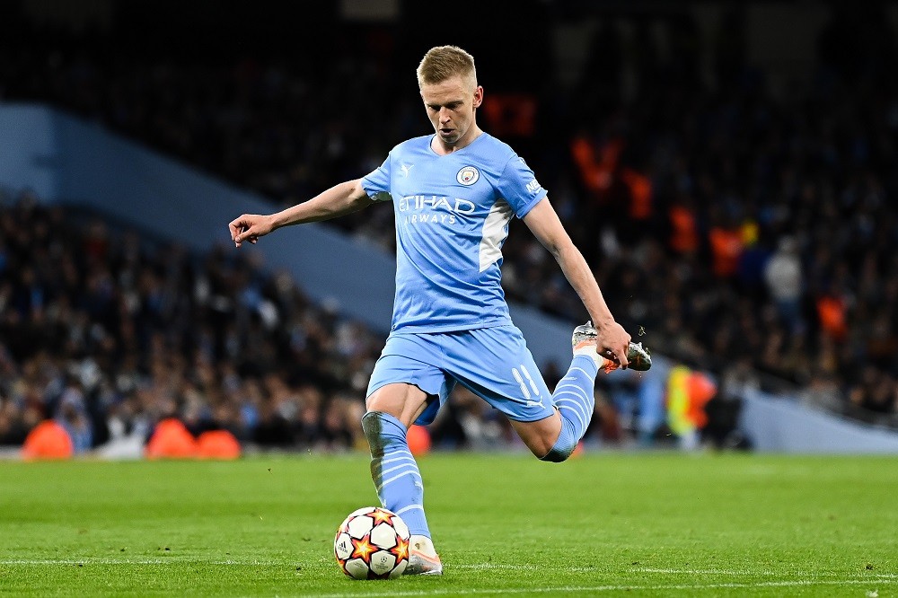 MANCHESTER, ENGLAND: Oleksandr Zinchenko of Manchester City FC runs with the ball during the UEFA Champions League Semi-Final Leg One match between Manchester City and Real Madrid at City of Manchester Stadium on April 26, 2022. (Photo by David Ramos/Getty Images)