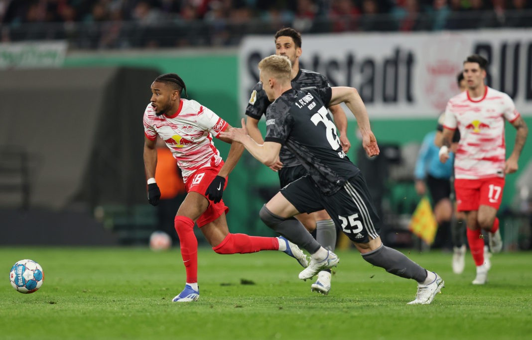 LEIPZIG, GERMANY: Christopher Nkunku of RB Leipzig runs with the ball whilst under pressure from Timo Baumgartl of 1.FC Union Berlin during the DFB Cup semi final match between RB Leipzig and 1. FC Union Berlin at Red Bull Arena on April 20, 2022. (Photo by Maja Hitij/Getty Images)