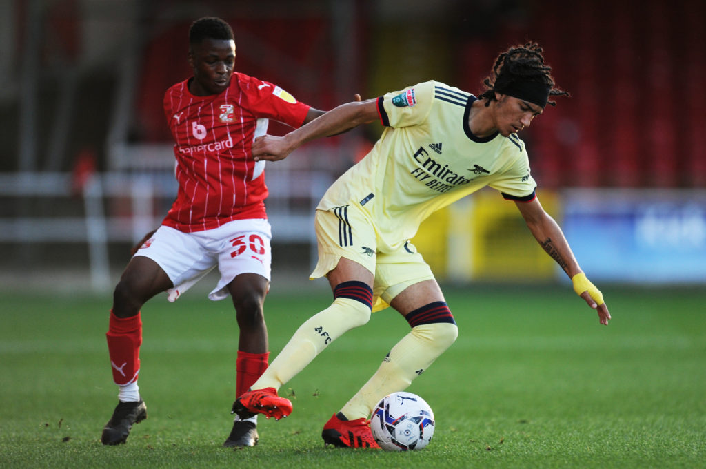 SWINDON, ENGLAND: Kido Taylor-Hart of Arsenal turns away from Mohammad Dabre of Swindon Town during the Papa John's Trophy match between Swindon Town and Arsenal U21 at County Ground on September 07, 2021. (Photo by Alex Burstow/Getty Images)