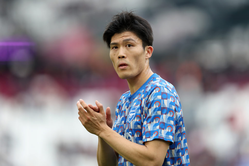 LONDON, ENGLAND: Takehiro Tomiyasu of Arsenal applauds their fans prior to kick off of the Premier League match between West Ham United and Arsenal at London Stadium on May 01, 2022. (Photo by Julian Finney/Getty Images)