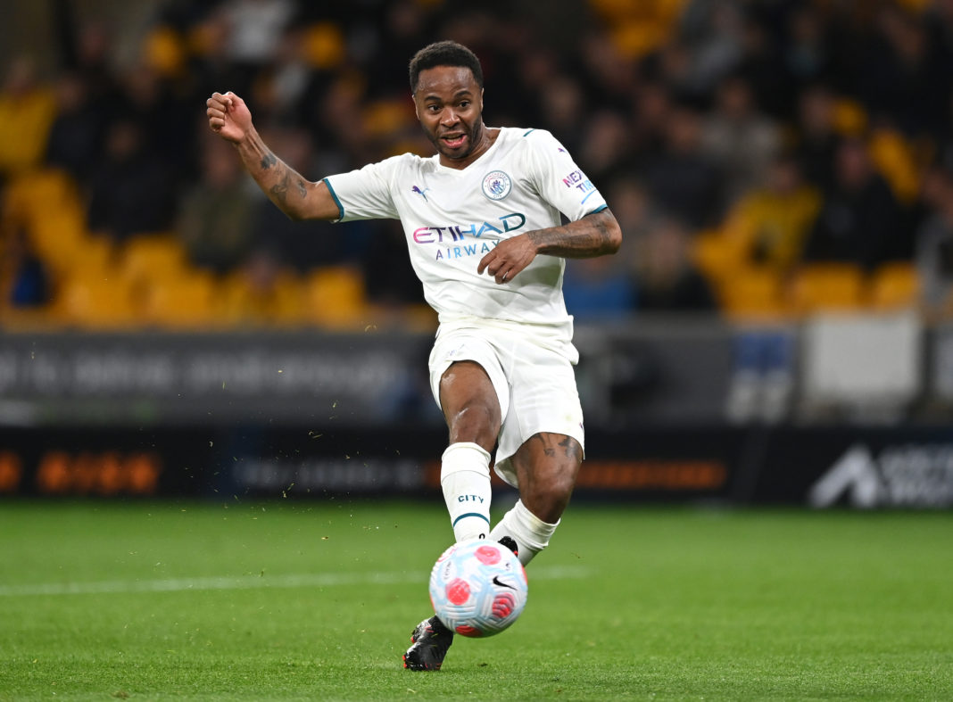WOLVERHAMPTON, ENGLAND: Raheem Sterling of Manchester City fires in a shot during the Premier League match between Wolverhampton Wanderers and Manchester City at Molineux on May 11, 2022. (Photo by Shaun Botterill/Getty Images)