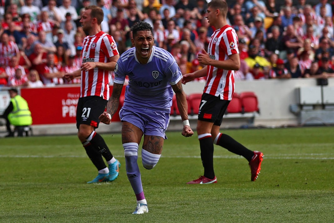 Leeds United's Brazilian midfielder Raphinha Dias Belloli celebrates after scoring the opening goal from the penalty spot during the English Premier League football match between Brentford and Leeds United at Brentford Community Stadium in London on May 22, 2022. (Photo by ADRIAN DENNIS/AFP via Getty Images)