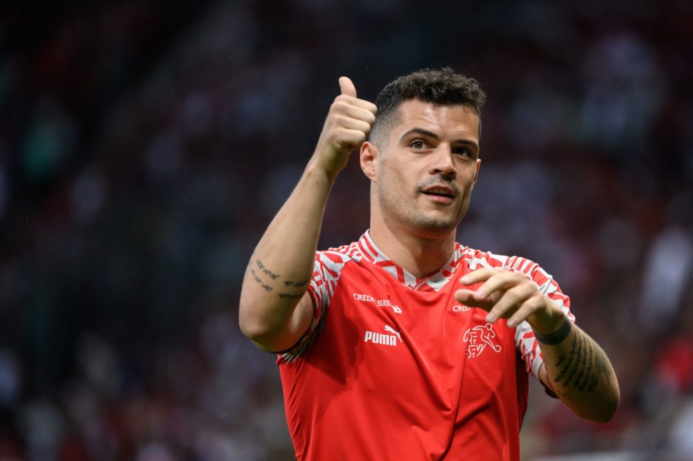 Switzerland's midfielder Granit Xhaka gives a thumb up to supporters prior to the UEFA Nations League - League A group 2 football match between Switzerland and Portugal at the Stade de Geneve in Geneva, on June 12, 2022. (Photo by FABRICE COFFRINI/AFP via Getty Images)