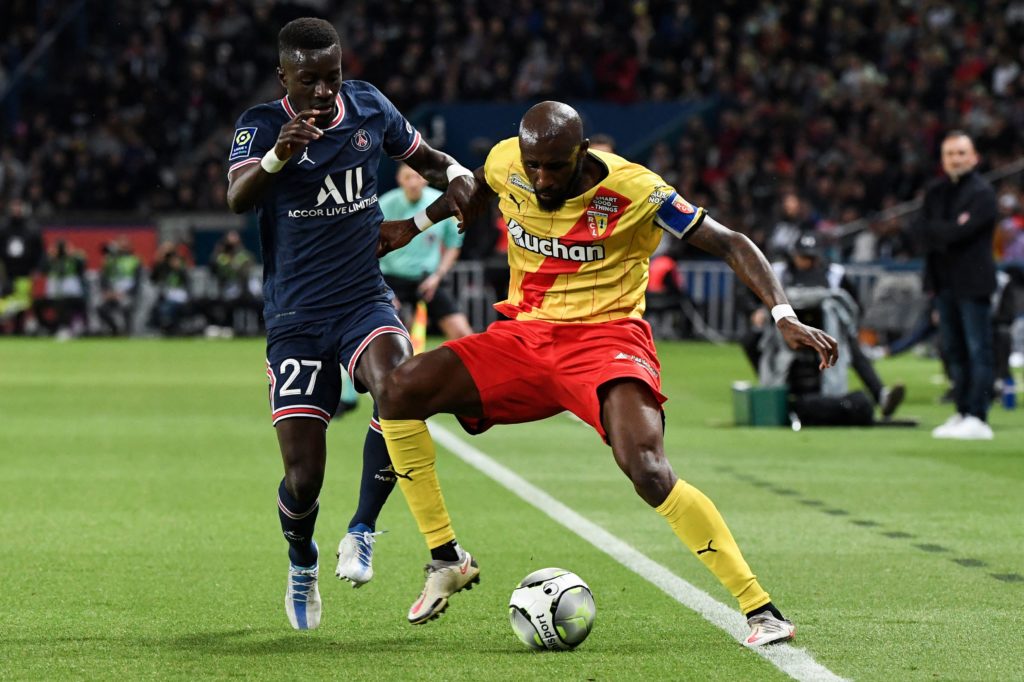 Paris Saint-Germain's Senegalese midfielder Idrissa Gueye (L) fights for the ball with Lens' Ivorian midfielder Seko Fofana during the French L1 football match between Paris-Saint Germain (PSG) and Lens (RCL) at The Parc des Princes Stadium in Paris on April 23, 2022. (Photo by ALAIN JOCARD/AFP via Getty Images)