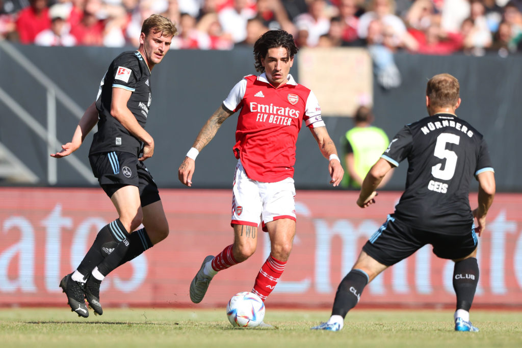 NUREMBERG, GERMANY: Hector Bellerin of Arsenal is challenged by Christoph Daferner and Johannes Geis of 1. FC Nuernberg during the pre-season friendly match between 1. FC Nürnberg and Arsenal F.C. at Max-Morlock-Stadion on July 08, 2022. (Photo by Alexander Hassenstein/Getty Images)