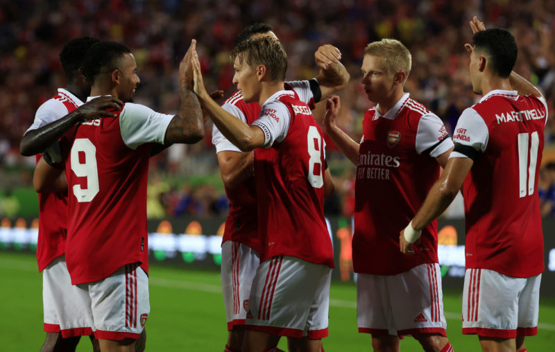 ORLANDO, FLORIDA - JULY 23: Martin Odegaard of Arsenal celebrates with teammates Gabriel Jesus and Oleksandr Zinchenko after scoring their side's second goal during the Florida Cup match between Chelsea and Arsenal at Camping World Stadium on July 23, 2022 in Orlando, Florida. (Photo by Mike Ehrmann/Getty Images)
